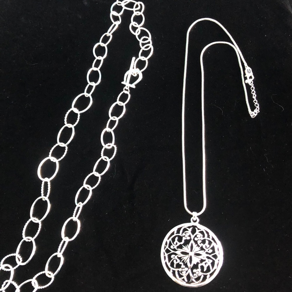 Two Etienne Aigner silver tone necklaces